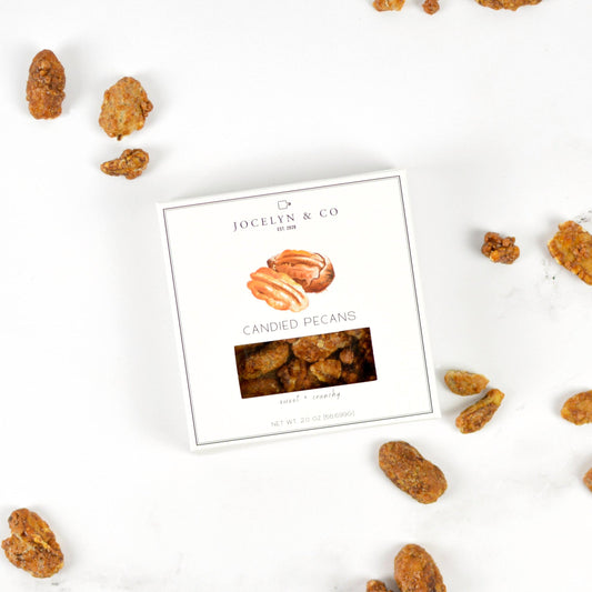 Candied pecans with a Jocelyn & Co packaging on a white background
